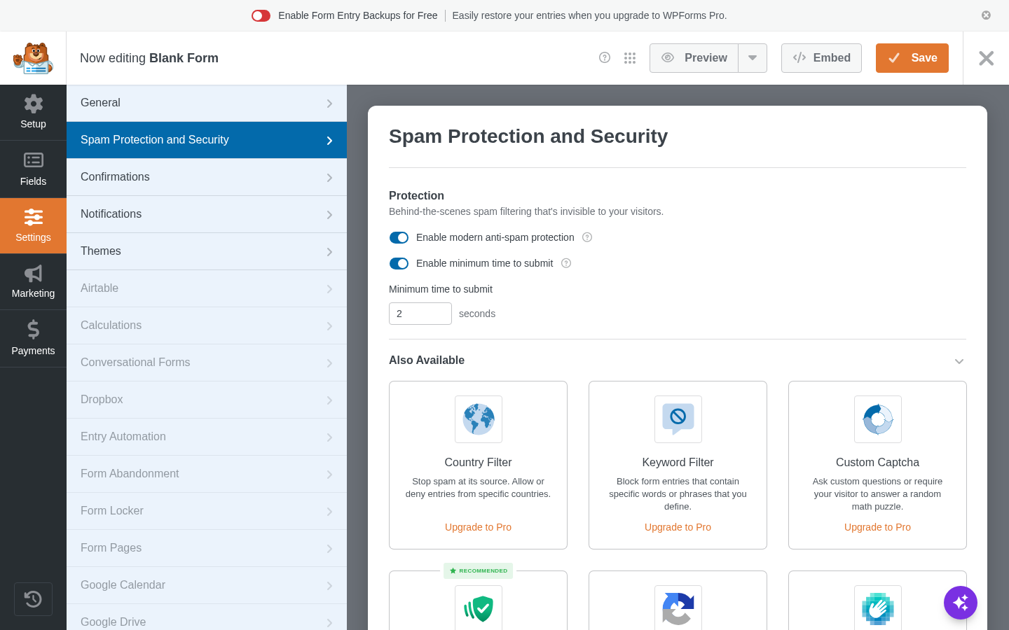 WPForms Spam Protection and Security panel showing two free toggles: Enable modern anti-spam protection and Enable minimum time to submit set to 2 seconds. Below those, an Also Available section shows three locked cards: Country Filter with Upgrade to Pro link, Keyword Filter with Upgrade to Pro link, and Custom Captcha with Upgrade to Pro link.