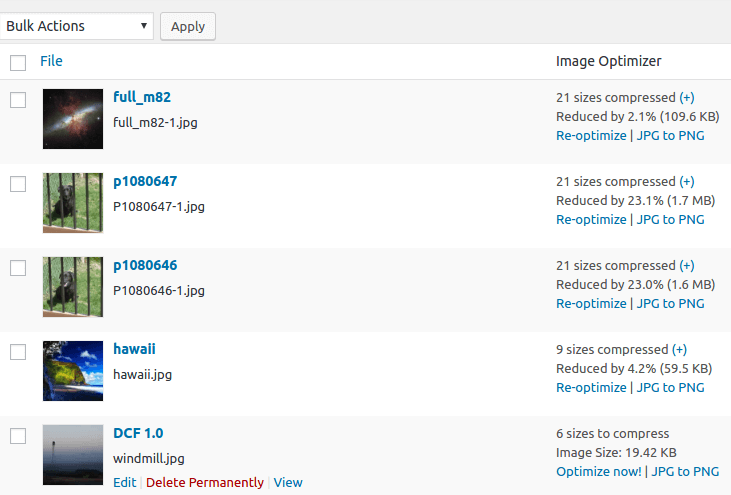 EWWW Image Optimizer Media Library view showing the Image Optimizer column added to the standard media listing. Images show compression results with savings of 2.1 percent to 23.1 percent per image with Re-optimize and JPG to PNG action links. Source: official vendor screenshot published on WordPress.org.